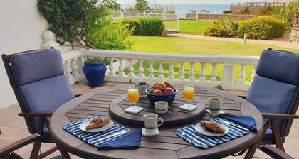 Spacious 2 bed, 2 bath frontline beach house. Sea & pool views metres from sea