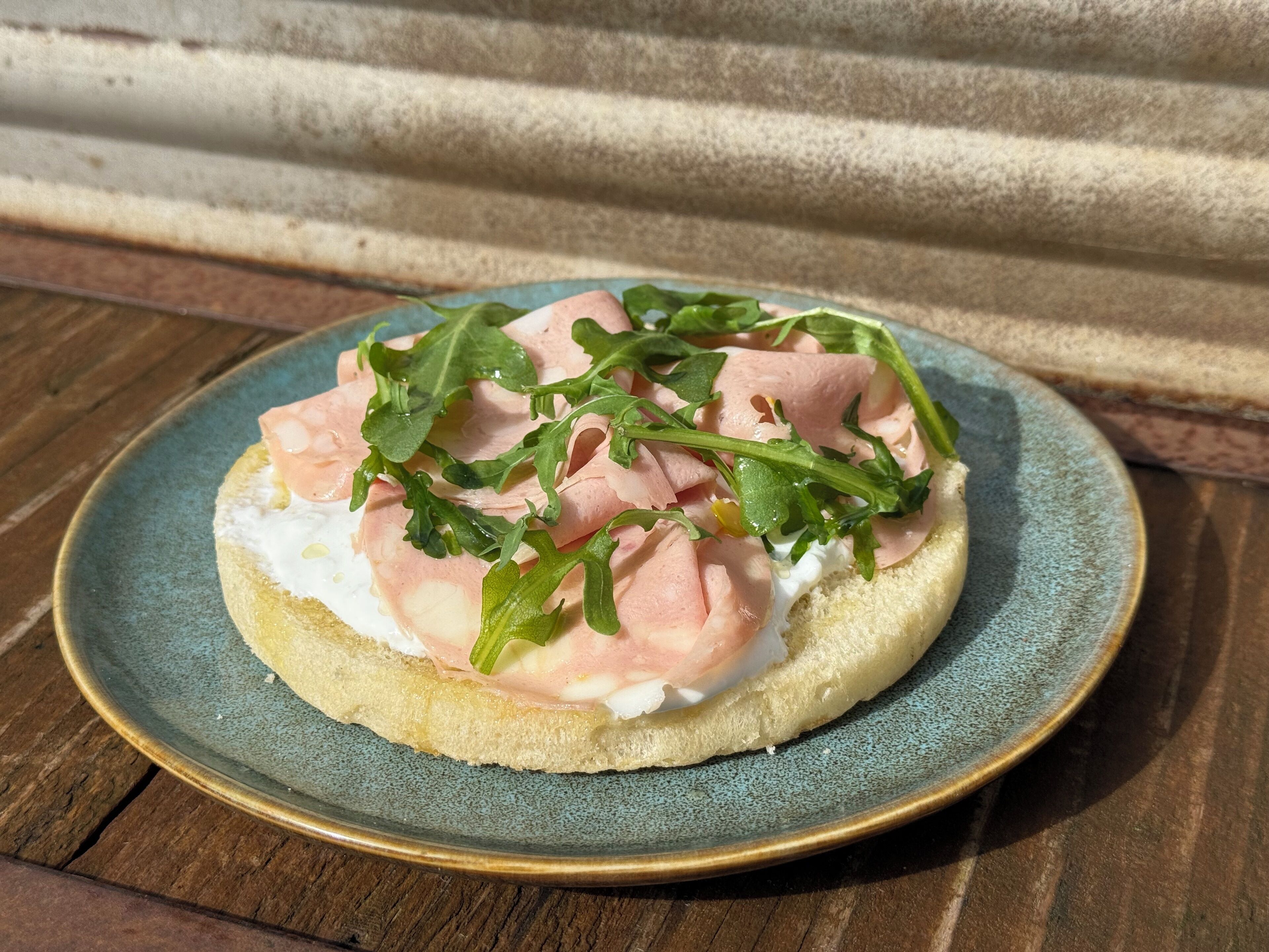 A sandwich on a ceramic plate.