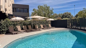 Seasonal outdoor pool, pool umbrellas, pool loungers