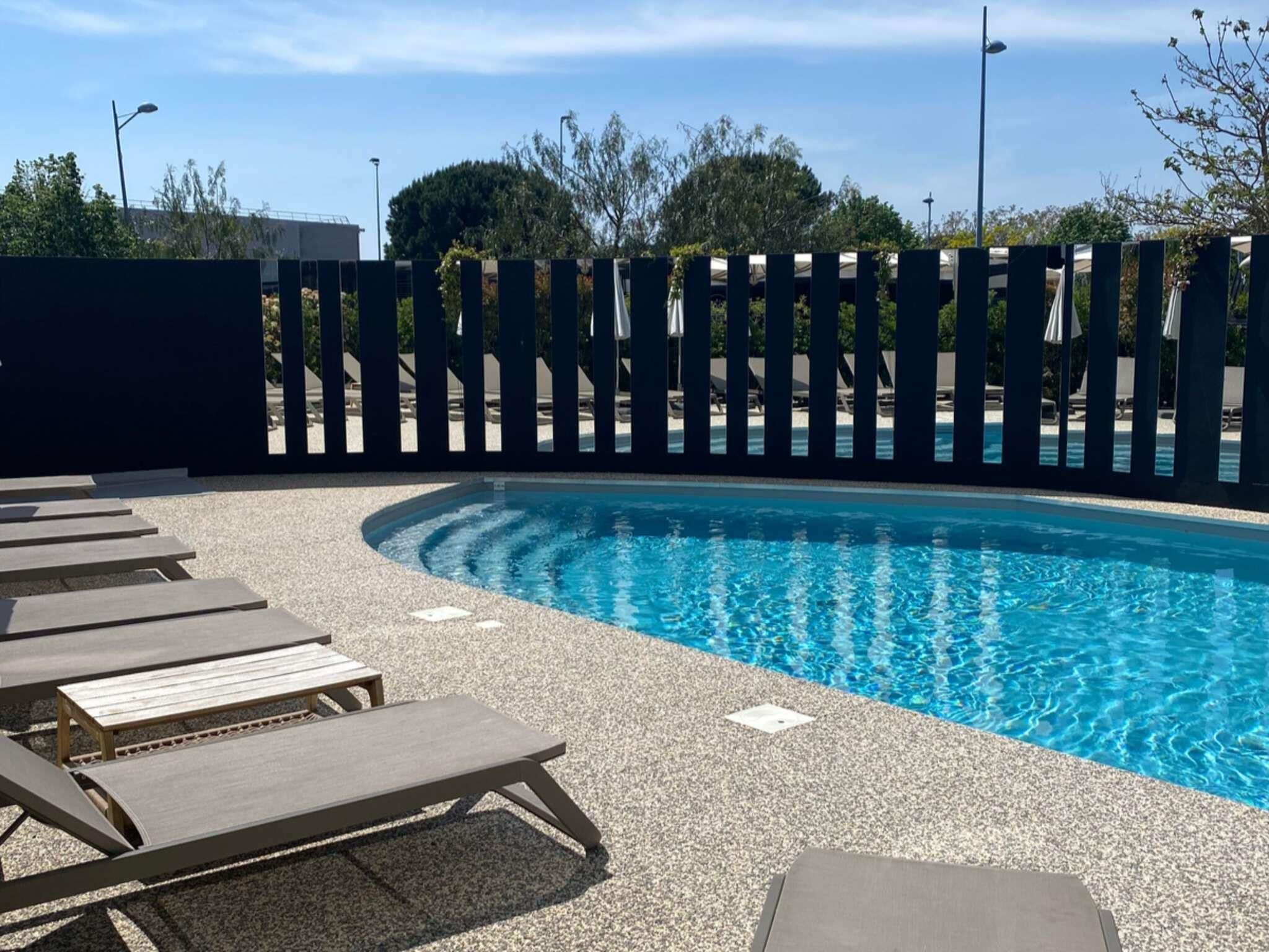Seasonal outdoor pool, pool umbrellas, pool loungers