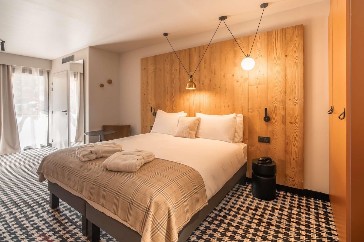 Habitación familiar, varias camas, balcón | 1 dormitorio, caja fuerte, sistema de insonorización y cunas gratuitas