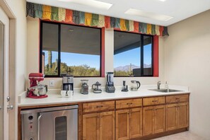 A kitchen with a built-in oven, a coffee maker, a blender, and a sink. - Saguaro Retreat-Salt Pool, Spa, Mountain Views (Tucson)