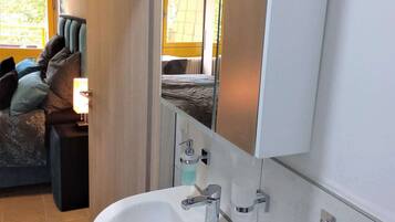 Shower, towels, soap, toilet paper