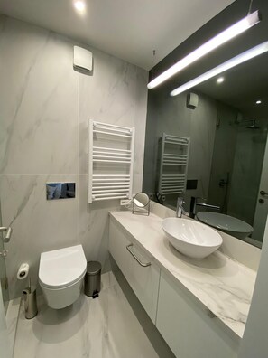 Shower, hair dryer, towels, soap