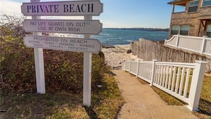 A private beach sign with warnings about no life guard on duty and prohibitions on alcohol, glass, smoking, animals, radios, coolers, and fireworks. - Sleep to the sound of the waves. Watch the sun set from the deck! Secluded beach (East Lyme)