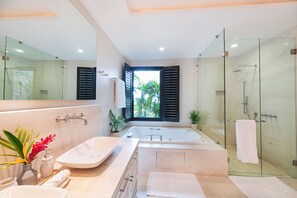 Bathtub, hair dryer, towels, soap