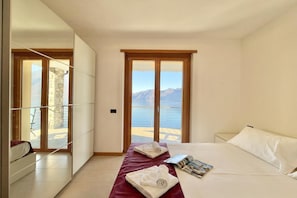 Family Apartment, 2 Bedrooms, Microwave, Mountainside (Residence degli Oleandri 4B) | 2 bedrooms, iron/ironing board, WiFi (surcharge), bed sheets