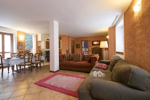 Apartment, 4 Bedrooms | Living area | 32-inch flat-screen TV with digital channels, TV