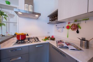 Family Apartment, Multiple Bedrooms, 2 Bathrooms, Mountainside (Como Lake Modern Apartment Ulivi) | Private kitchen | Full-size fridge, microwave, oven, stovetop - Como Lake Modern apartment Ulivi (Tremezzina)