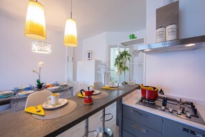 Family Apartment, Multiple Bedrooms, 2 Bathrooms, Mountainside (Como Lake Modern Apartment Ulivi) | Private kitchen | Full-sized fridge, microwave, oven, stovetop - Como Lake Modern apartment Ulivi (Tremezzina)