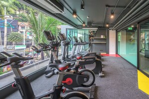 A gym with stationary bikes, treadmills, and exercise equipment. - COSI Krabi Ao Nang Beach (Krabi)