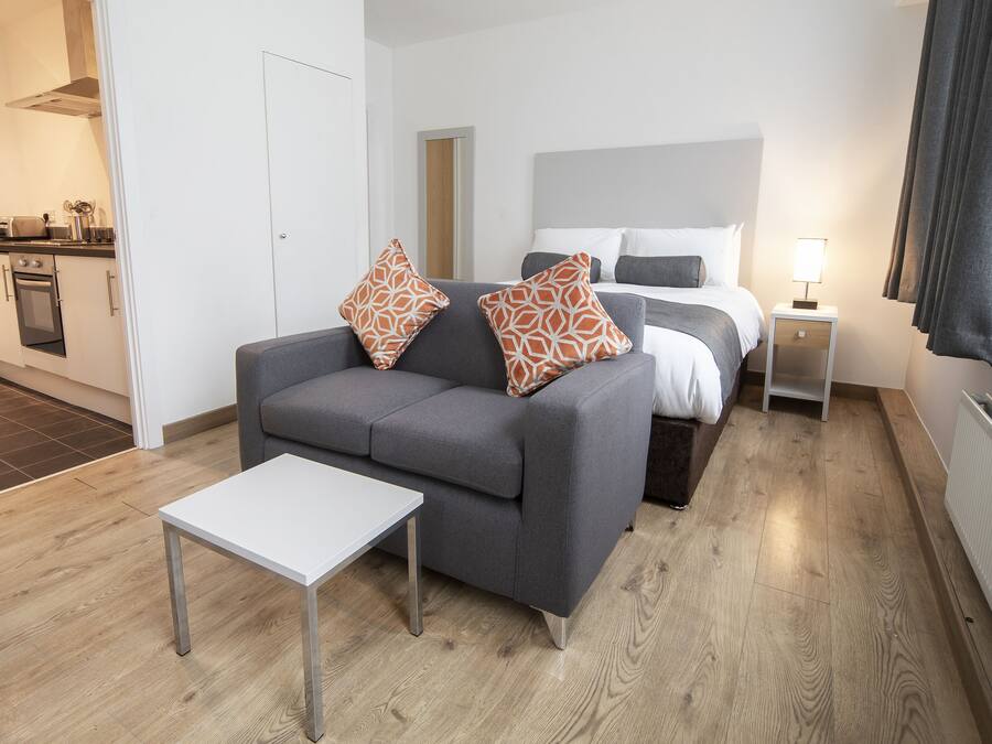 Hypo-allergenic bedding, desk, laptop workspace, blackout curtains