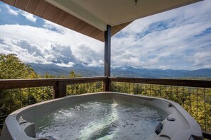 A hot tub with a view of mountains and trees. - Postcard View of GSMNP/3.6 Miles 2 DwTn Gatlinburg (Gatlinburg)