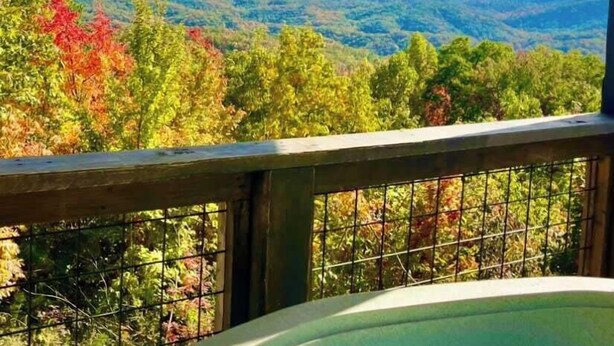 A hot tub with a mountain view.