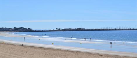 On the beach, sun-loungers