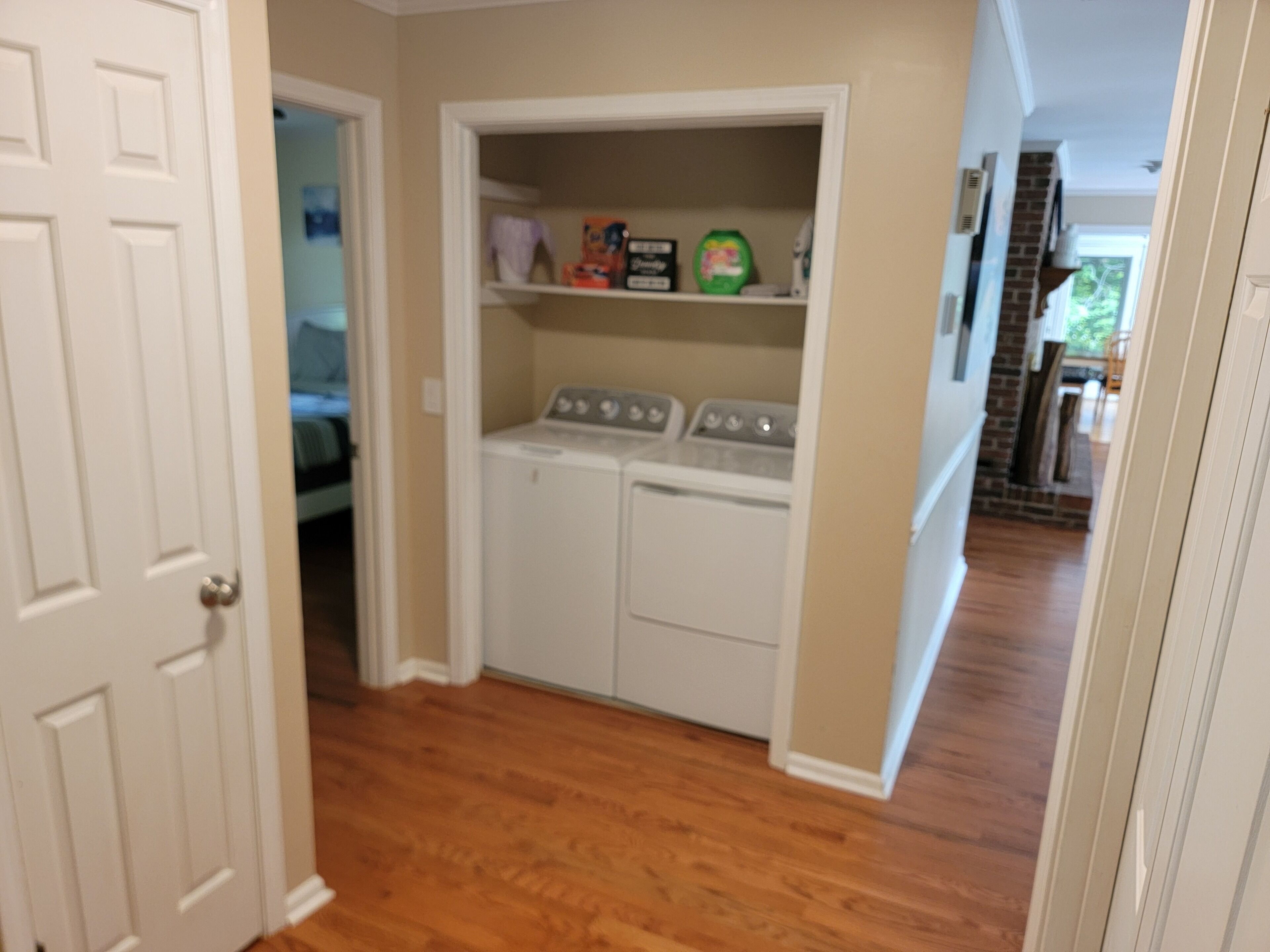 Hallway with new LG washer/dryer.  Dining room top right.  Q bedroom top left