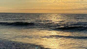 On the beach, sun-loungers, beach towels