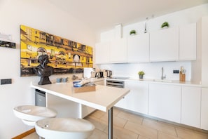 Family Apartment, 2 Bedrooms, Mountainside (Residence degli Oleandri 1A) | Private kitchen | Full-size fridge, microwave, oven, stovetop