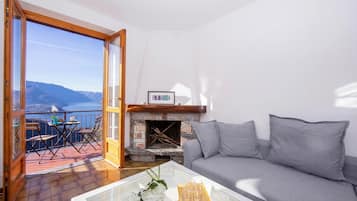 Family Apartment, Multiple Bedrooms, Mountainside (Balcone di Perledo) | Living area | Flat-screen TV, fireplace