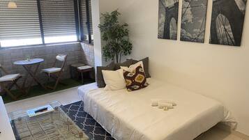 Iron/ironing board, travel crib, free WiFi, bed sheets