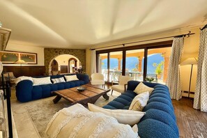 Family Villa, Multiple Bedrooms, Mountainside (Villa Isola Verde) | Living area | Flat-screen TV, fireplace, iPod dock, stereo - Villa Isola Verde (Valsolda)