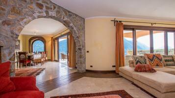 Family Villa, Multiple Bedrooms, Mountainside (Villa Isola Verde (Main Villa)) | Living area | Flat-screen TV, fireplace, MP3 dock, stereo