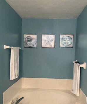 Bathtub, hair dryer, towels, soap