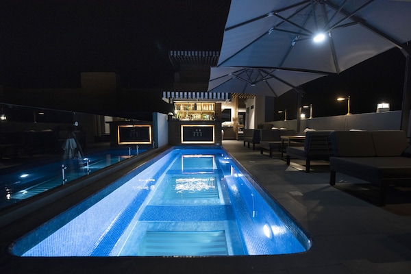 Outdoor pool, open 8:00 AM to 8:00 PM, pool loungers