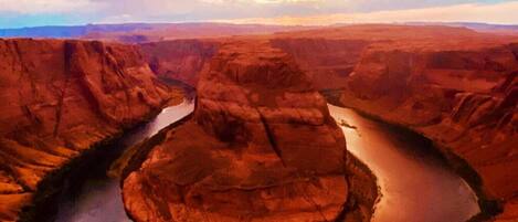 A canyon with a river winding through it.