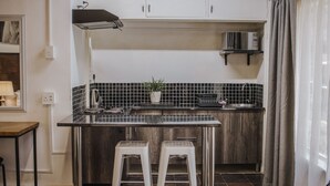Luxury Studio Suite, 1 Bedroom | Private kitchen | Coffee/tea maker, fridge, microwave, stovetop - Casa Leitao Lodge (Phalaborwa)