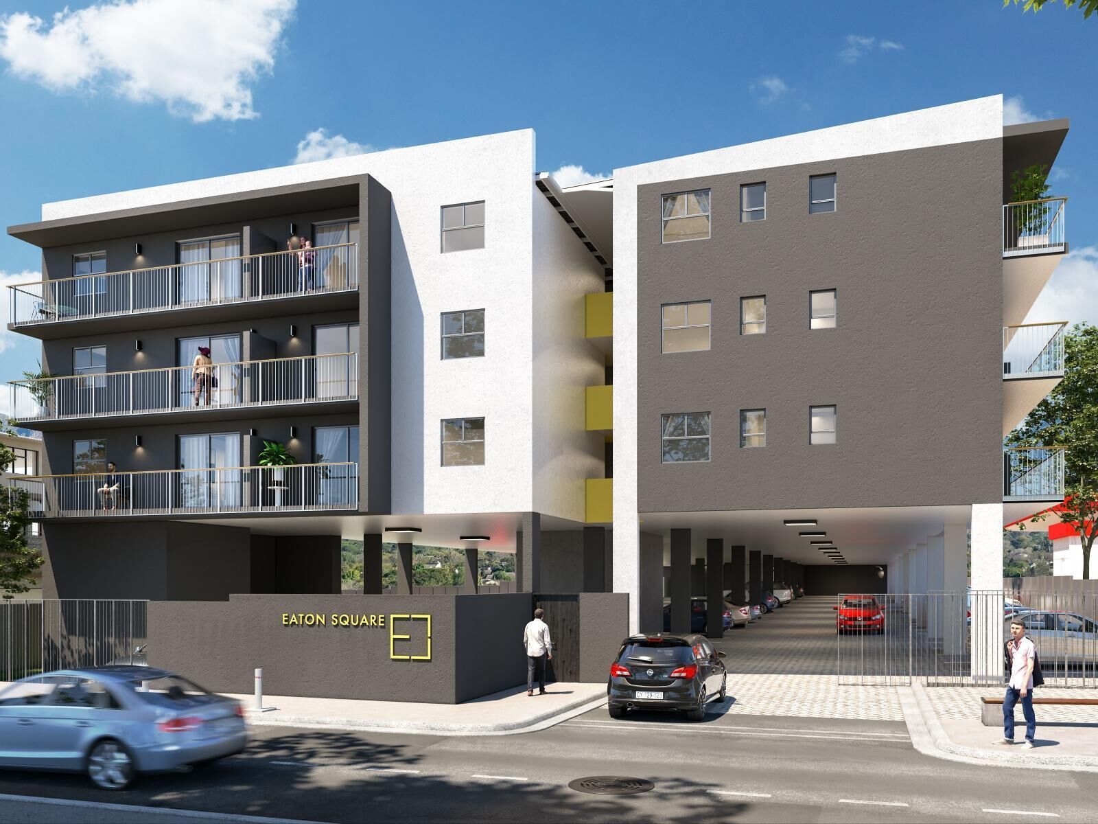 A modern multi-story building with balconies and a covered parking area.