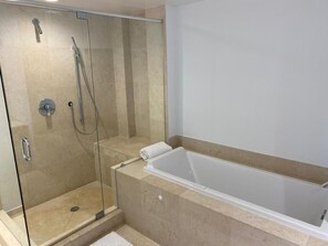 Bathtub, towels, toilet paper