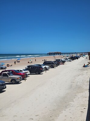 On the beach, sun loungers, beach towels