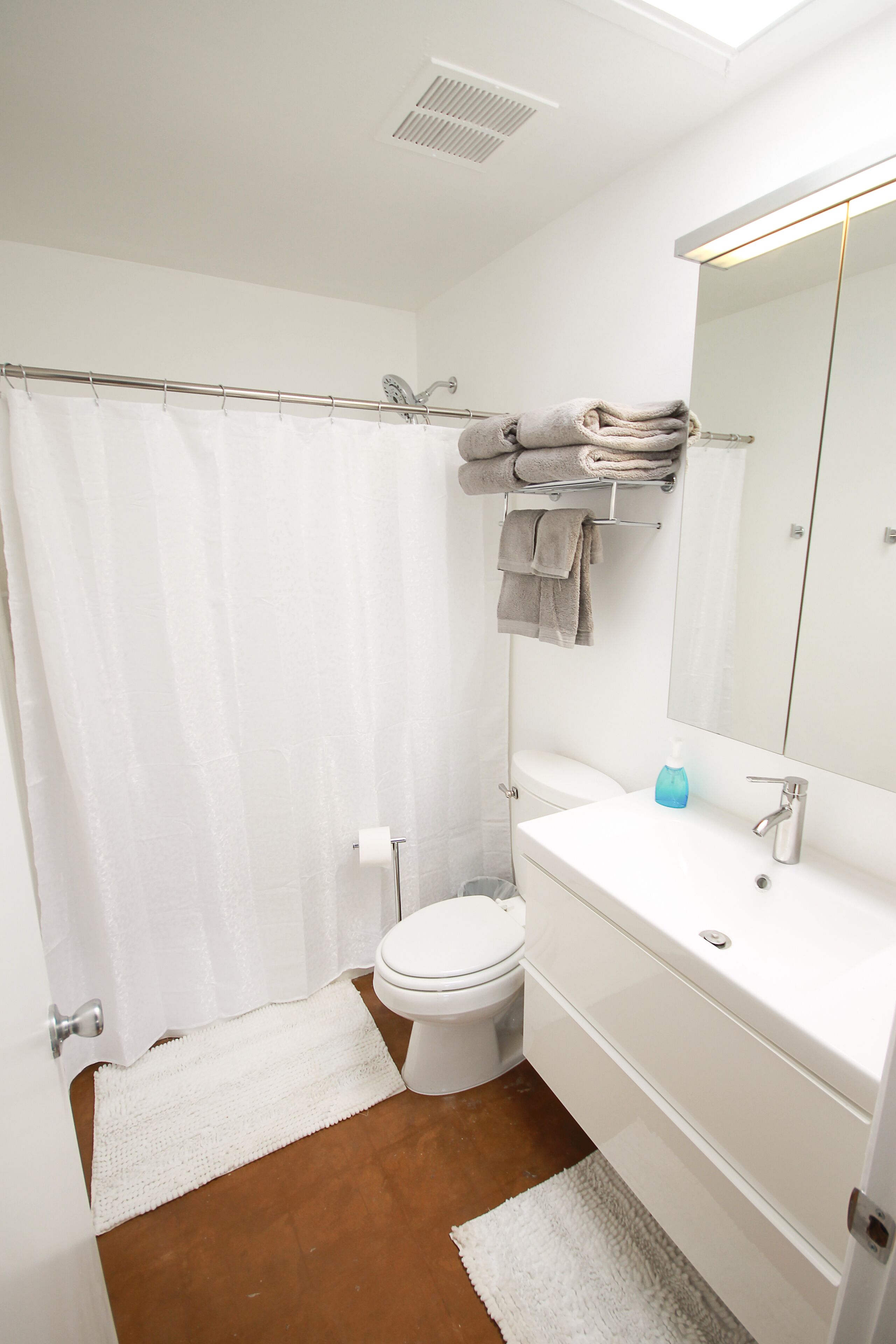 Combined shower/tub, hair dryer, towels, toilet paper