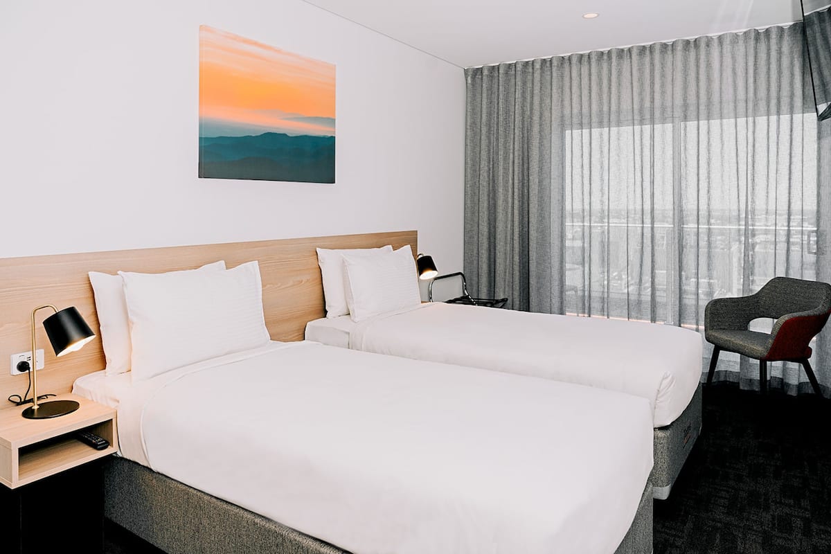 Luxe beddengoed, pillowtop-bedden, een kluis op de kamer, een bureau