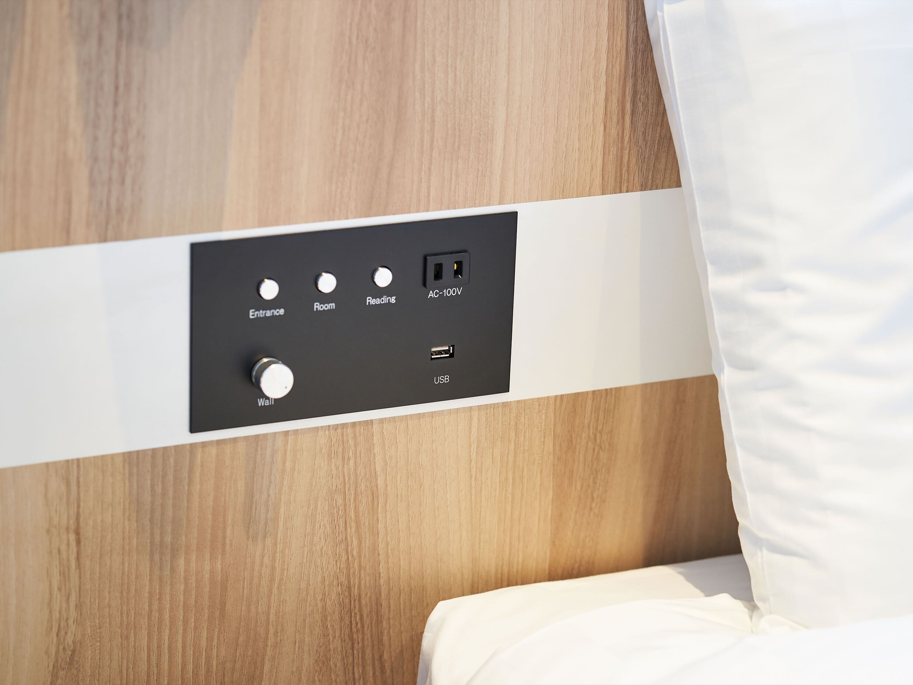 A control panel with buttons labeled Entrance, Room, Reading, and Wall, along with an AC-100V outlet and a USB port.