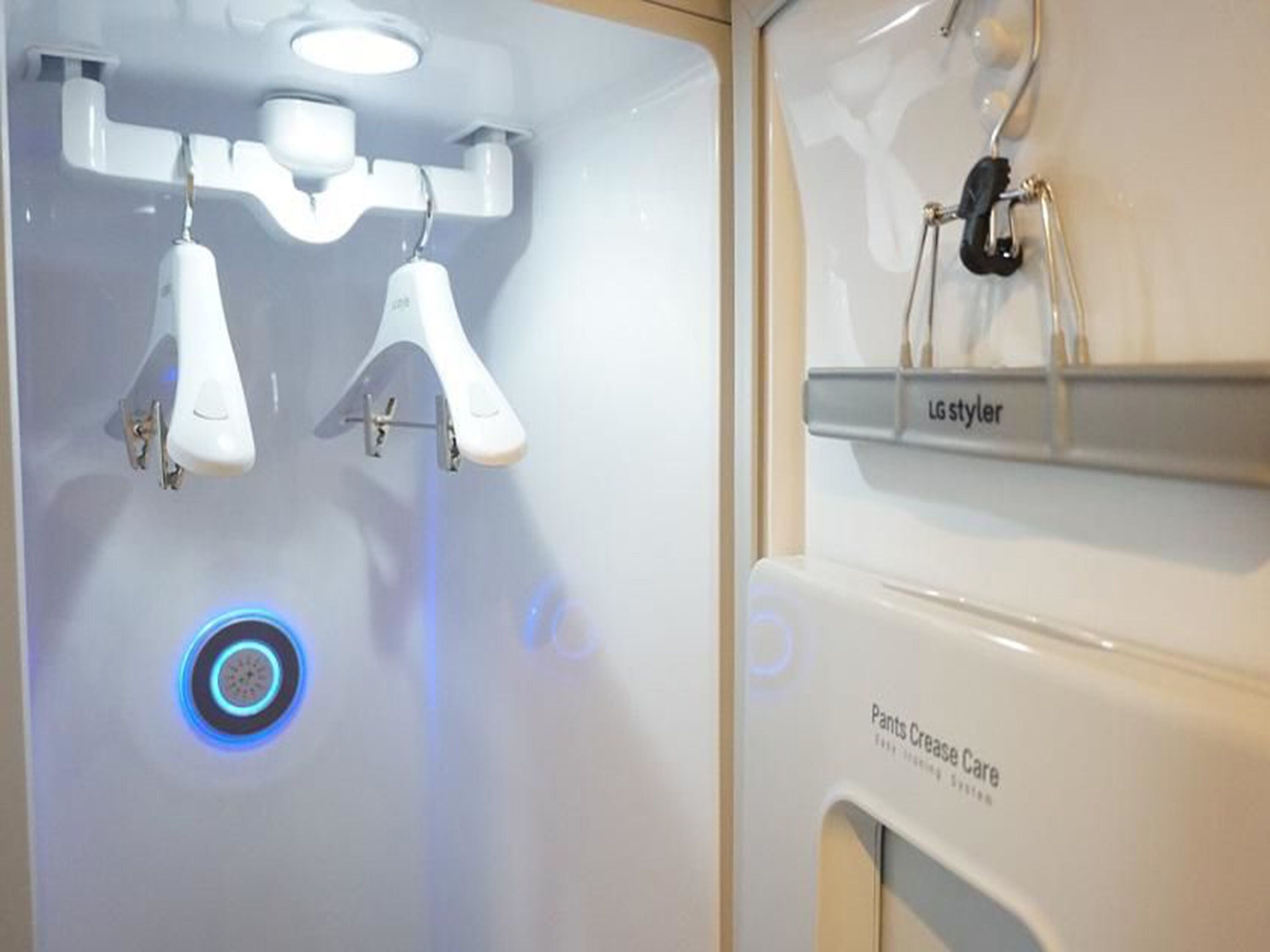 A bathroom with a modern design, including a toilet, a bidet, and a vanity with a mirror.