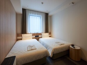 Twin Room, Non Smoking, Corner | In-room safe, desk, laptop workspace, blackout drapes