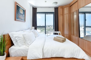 Apartment, 2 Bedrooms, Balcony, Beach View | 2 bedrooms, individually decorated, individually furnished