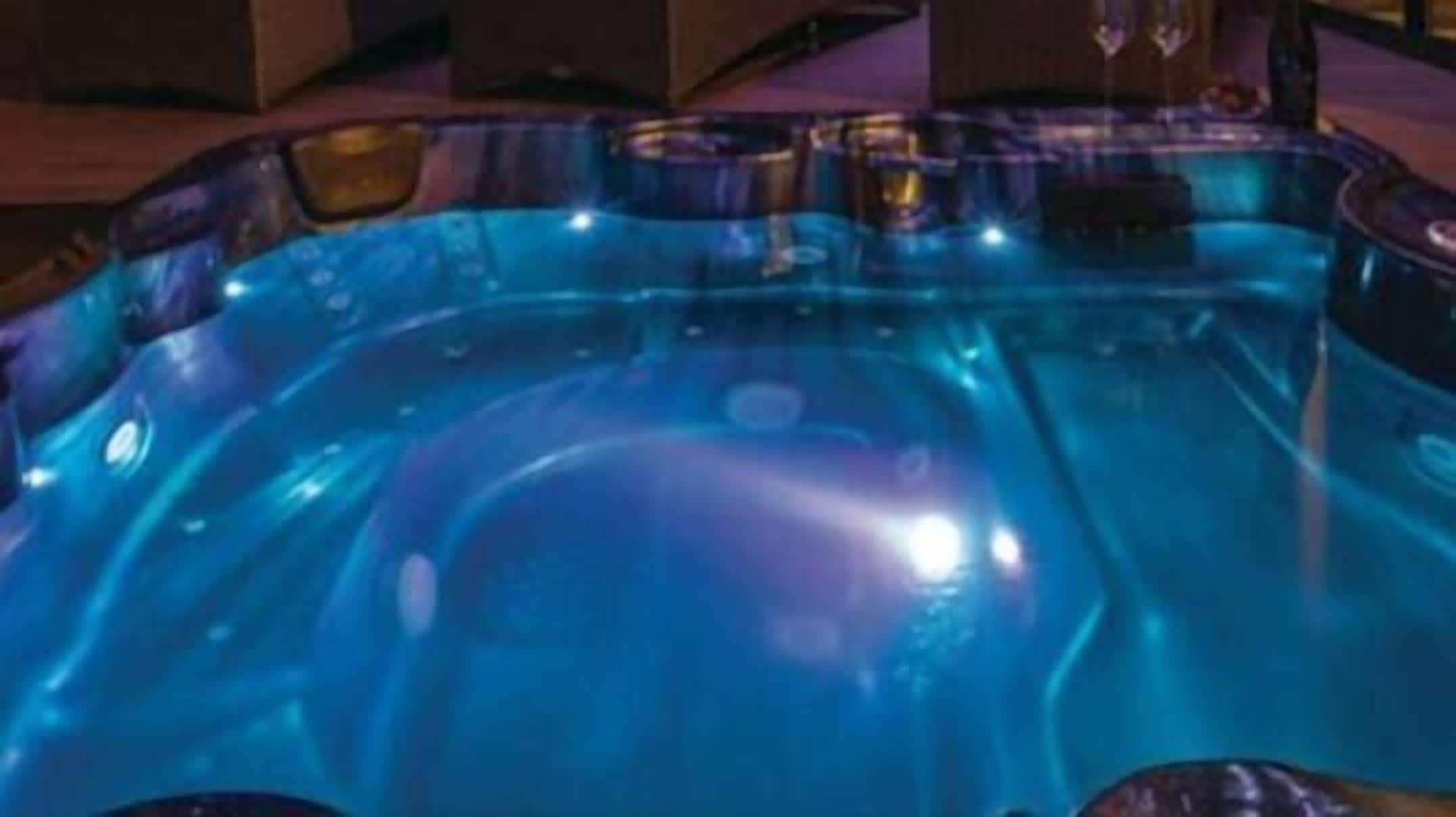 A hot tub with a blue light.
