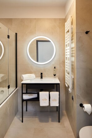 Bathtub, hair dryer, towels, soap