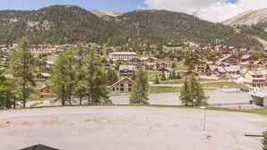 A residential area with multiple houses and a parking lot.