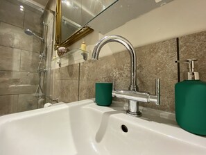 Combined shower/bathtub, soap, toilet paper