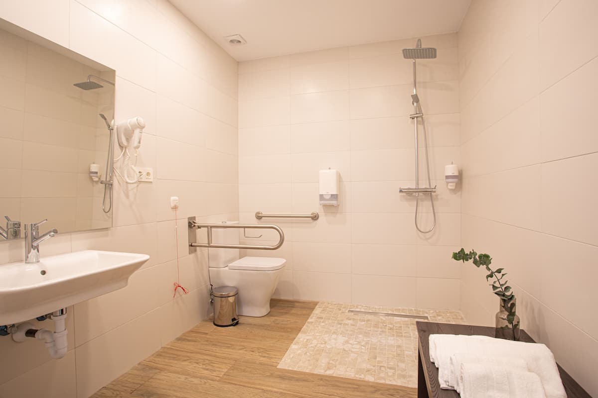 superior room | bathroom | shower, hair dryer, towels, soap