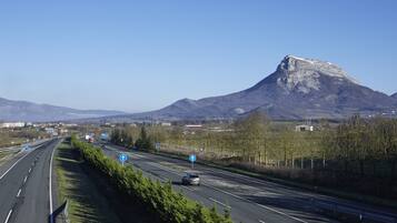 A highway with a mountain in the background.