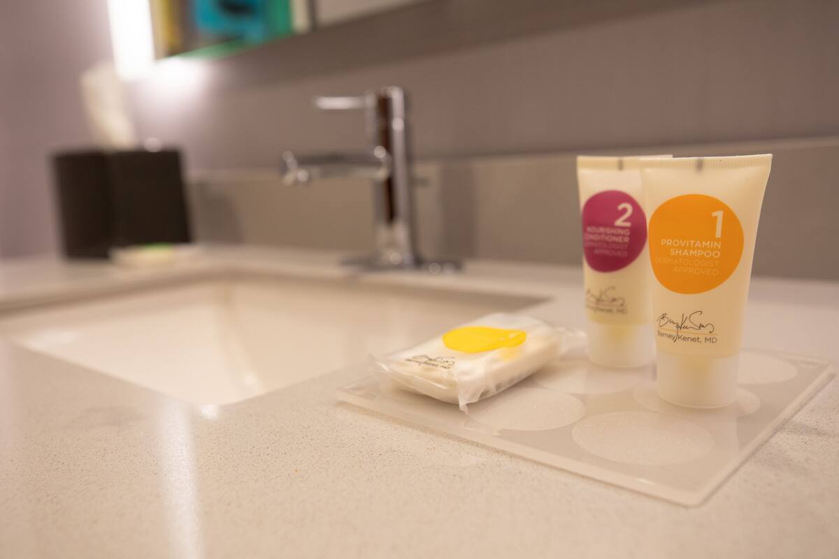 hair dryer, towels, soap, shampoo