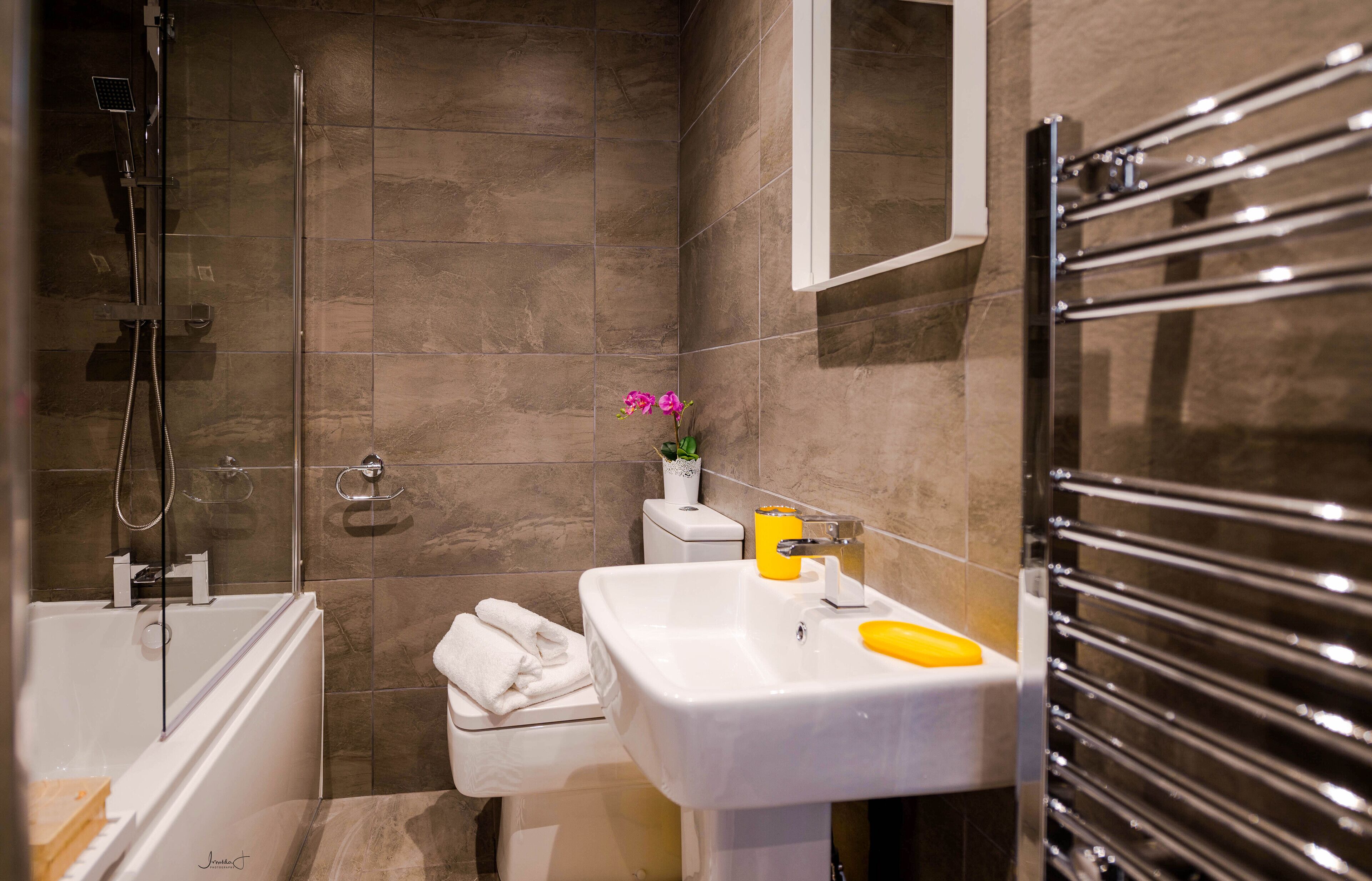 Combined shower/bathtub, hair dryer, towels, soap