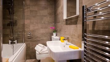 Combined shower/bathtub, hair dryer, towels, soap