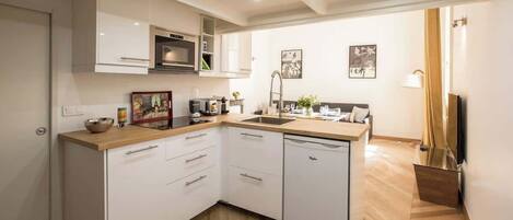 Fridge, microwave, stovetop, coffee/tea maker