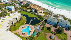 An aerial view of a coastal resort with a swimming pool, beach access, and beachfront villas. -  GULF FRONT on 30A with Beach setup! (Santa Rosa Beach)